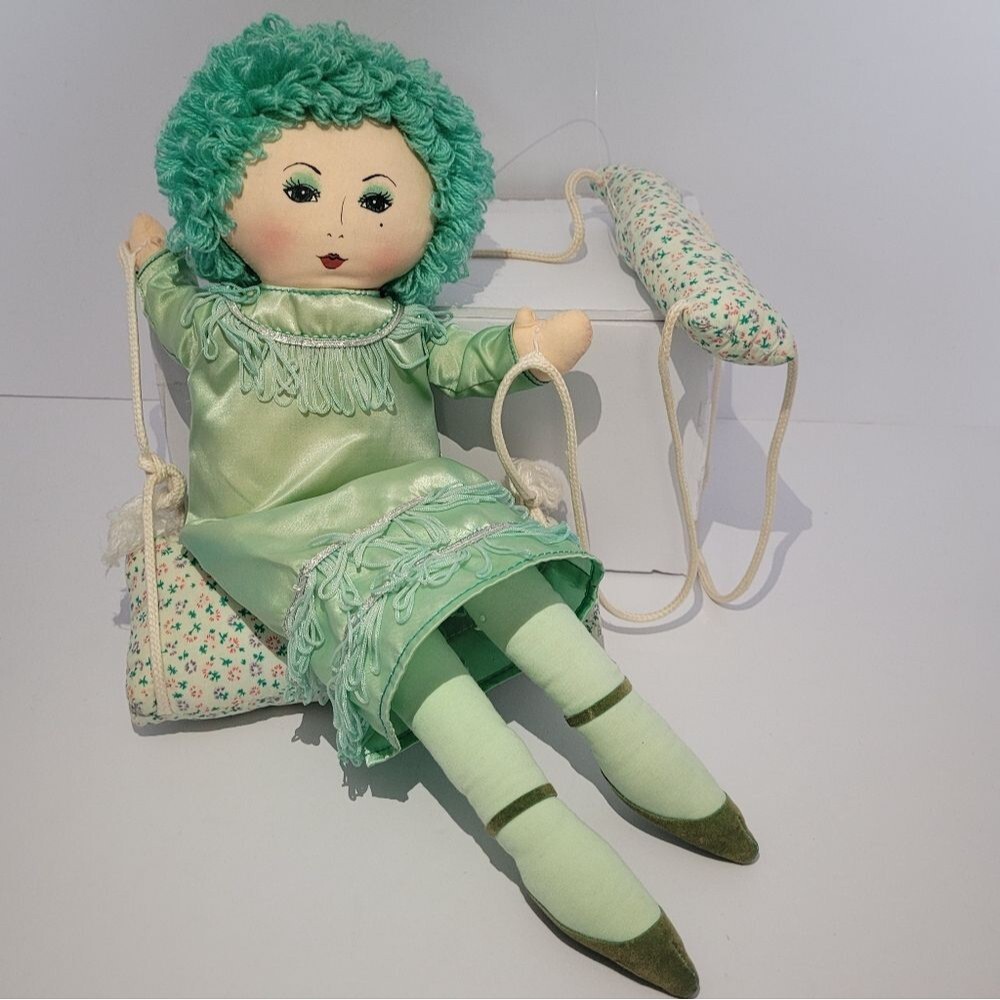 vintage Russ Berrie Green hanging Trapeze doll on a swing